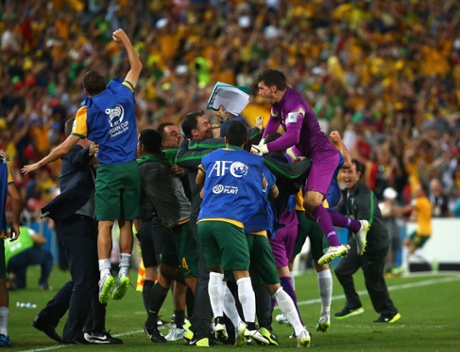 The Australian bench go wild after James Troisi scores in extra time.