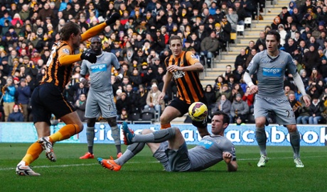 Hull City's Nikica Jelavic has a shot blocked by Michael Williamson.
