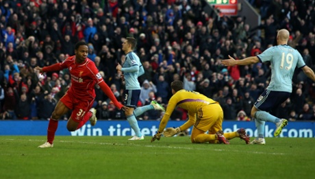 Liverpool's Raheem Sterling celebrates after scoring from Philippe Coutinho's through ball.