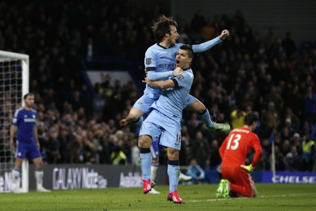 David Silva and Sergio Aguero celebrate the equaliser. Courtois flapped the ball into Aguero's path to set up the goal.