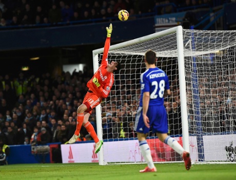 Thibaut Courtois tips the ball over the bar.