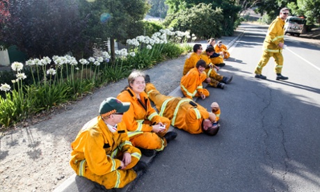Volunteer Country Fire Authority fire fighters relax after fighting bush fires across the Adelaide Hills, in Gumeracha, Australia, 04 January 2015.