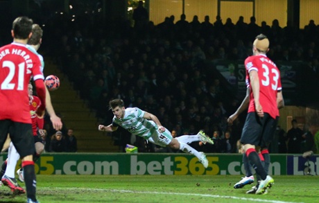 Joe Edwards of Yeovil Town sees his goal bound diving header cleared.