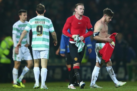 Joseph Edwards (R) of Yeovil Town cuts a dejected figure after swapping shirts with Wayne Rooney (2R) of Manchester after his sides 0-2 defeat.