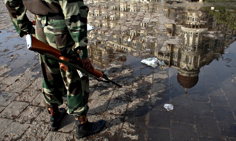 An Indian soldier stands guard outside the Taj Mahal, Mumbai, after the 2008 terrorist siege. The recent boat incident has evoked memories of the attacks. Photograph: Getty