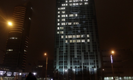 A large euro symbol appears on the Vilnius municipality building in Vilnius, as Lithuania became the 19th member of the currency bloc.