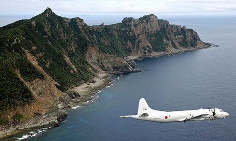 A Japanese surveillance plane flies over the disputed islands in the East China sea