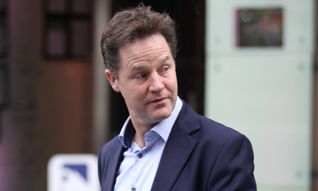 Nick Clegg, specs in jacket pocket, looks over his shoulder as he walks