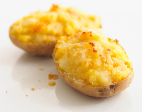 Jacket potato halves with cheese and sweetcorn filling