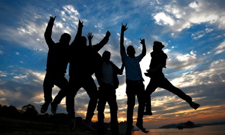 People jumping at sunset