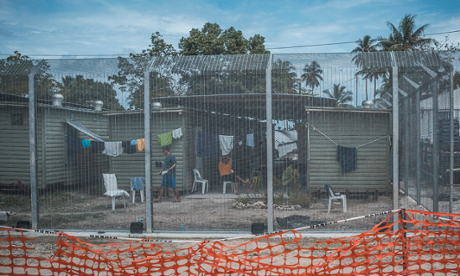 Asylum seekers in front of their housing units at the Manus Island Regional Processing Centre at Lombrum.