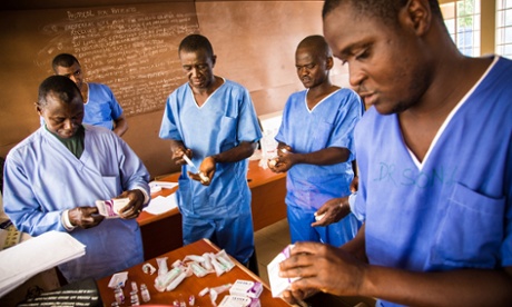 Healthcare workers prepare medicines at an Ebola treatment centre in Freetown.