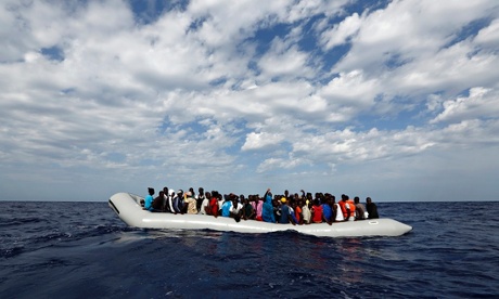 A rubber dinghy with 104 sub-Saharan Africans on board waiting to be rescued 