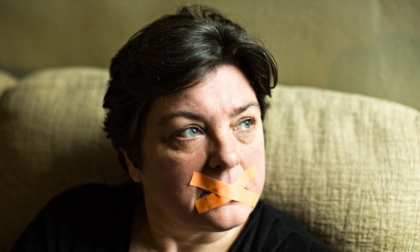 Julie Bindel with tape over her mouth