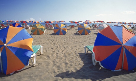 Rows of parasols on the beach.