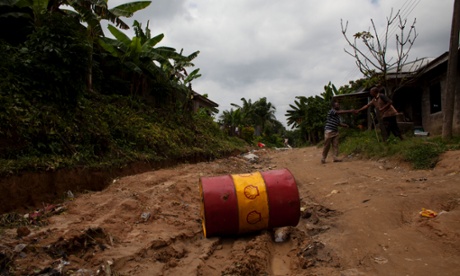 A Shell oil drum lies in the middle of the road in Bodo, Nigeria on Thursday, June 10, 2010.