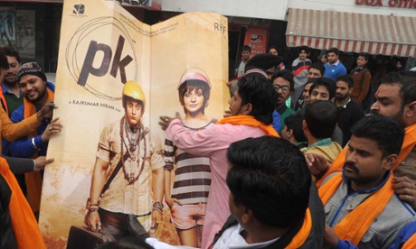 Activists prepare to burn a PK poster for allegedly offending Shiv Sena religious sentiments.