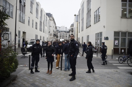 Police forces gather in street outside Charlie Hebdo offices