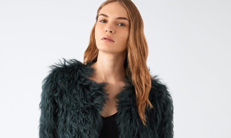 A model wears Jigsaw degrade sheepskin coat