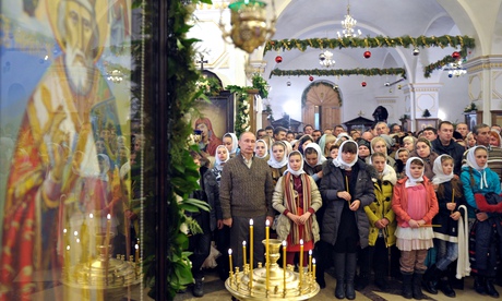 Vladimir Putin attends midnight mass in Voronezh