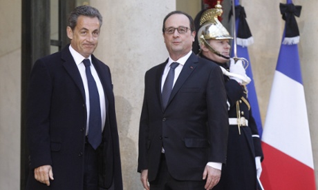 Former French President Nicolas Sarkozy, left, poses with current President Francois Hollande prior to their meeting at the Elysee Palace in Paris.