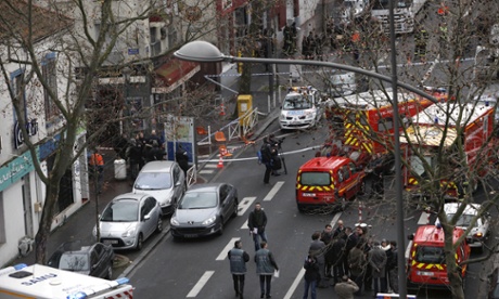 Police officers, firefighters and rescue workers at the site of a shooting in Montrouge, south of Paris.
