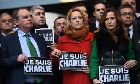 European Parliament members hold a minute of silence.