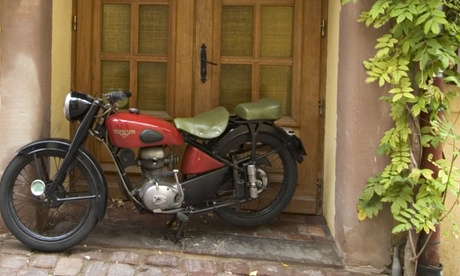 Motorbike parked by front door 