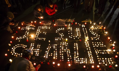 Candles spell out the words 'Je Suis Charlie'