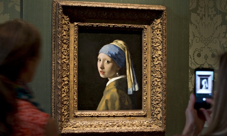 Vermeer's Girl with a Pearl Earring, hanging in the Mauritshuis.