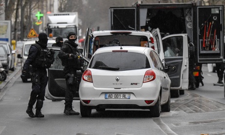 Police inspect vehicles  in Montrouge on Thursday.   A policewoman was killed and a city employee seriously hurt after a man opened fire.