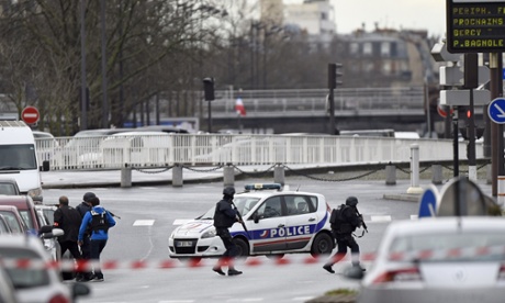 Police forces gather together at Porte de Vincennes, east of Paris, after a gunman opened fire at a kosher grocery store