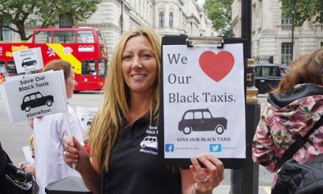 Black taxi cab drivers along with their families protesting outside Downing Street last month.