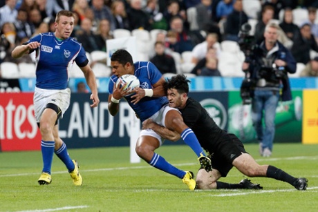 New Zealand's Nehe Milner-Skudder makes a tackle on Chrysander Botha of Namibia.