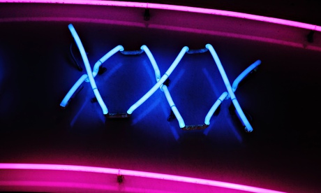 XXX neon sign advertising an adult licensed sex shop in a red light district