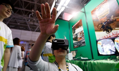 Wearing an Oculus Rift headset to play a video game in the Pocket Queries booth at the this year's Tokyo Game show.