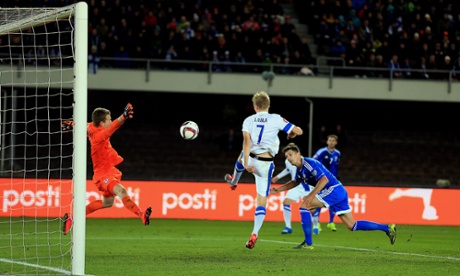 Craig Cathcart's header was cancelled out by Finland's Pauluis Arajuuri but a draw was enough for Northern Ireland to win Group F