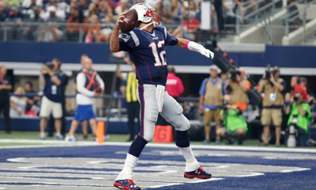 New England Patriots quarterback Tom Brady celebrates after a scoring the team's first touchdown against the Dallas Cowboys.