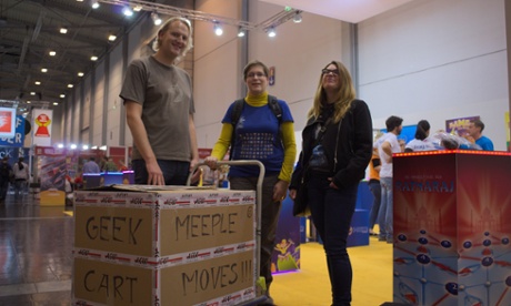 Attendees at Essen Spiel with their purchases