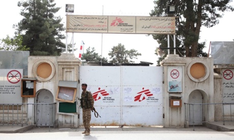 A policeman stands guard in front of the MSF hospital in Kunduz, Afghanistan, which was destroyed by a US airstrike on 3 October.