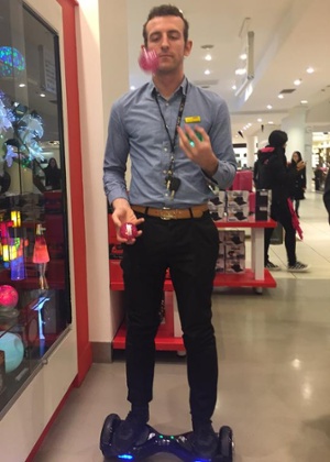 Sales assistant at Selfridges juggling on a segway