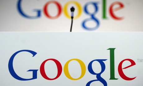 A file picture shows a microphone in front of a Google logo.