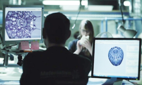 Staff looking at computers 