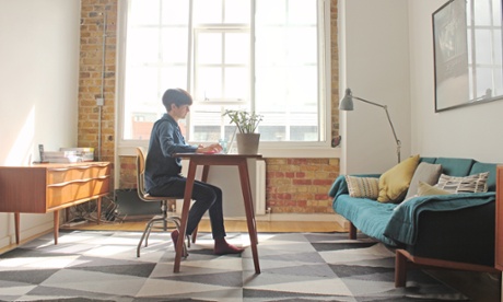 woman sitting at a work desk at home