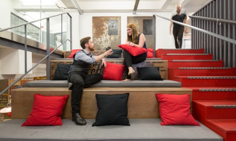 Two colleagues on a comfy seated office area