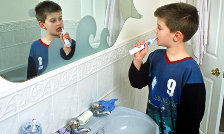 Just the job? boy with electric toothbrush. 