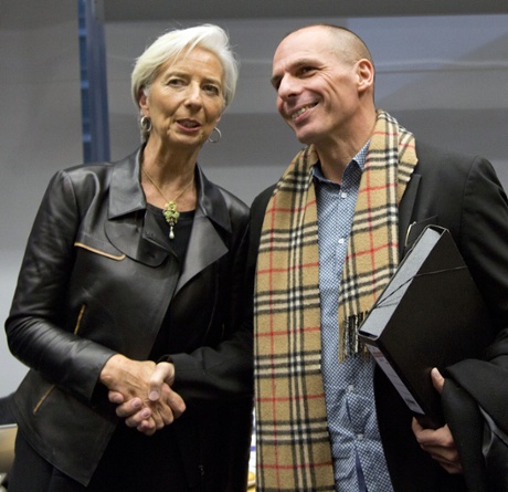 Managing Director of the International Monetary Fund Christine Lagarde, left, shakes hands with Greek Finance Minister Yanis Varoufakis during a meeting of eurogroup finance ministers in Brussels on Wednesday, Feb. 11, 2015. Leading European officials downplayed expectations that a comprehensive debt deal with Greece is likely Wednesday at an emergency meeting in which Greece s finance minister is set to unveil a plan to loosen austerity s grip on his economy. (AP Photo/Virginia Mayo)