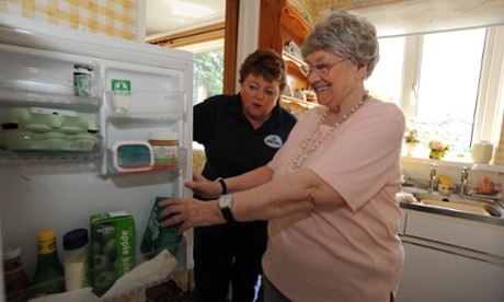 A care workers supports someone in their own home.