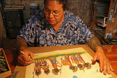 Ledger art … Evans Flammond painting warriors on old account books.