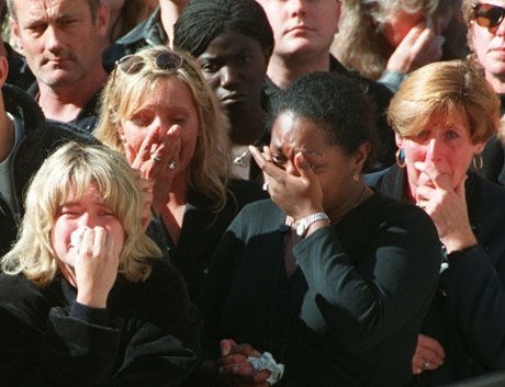 Spectators weep in the crowd along London’s Whitehall during funeral ceremonies for Princess Diana.